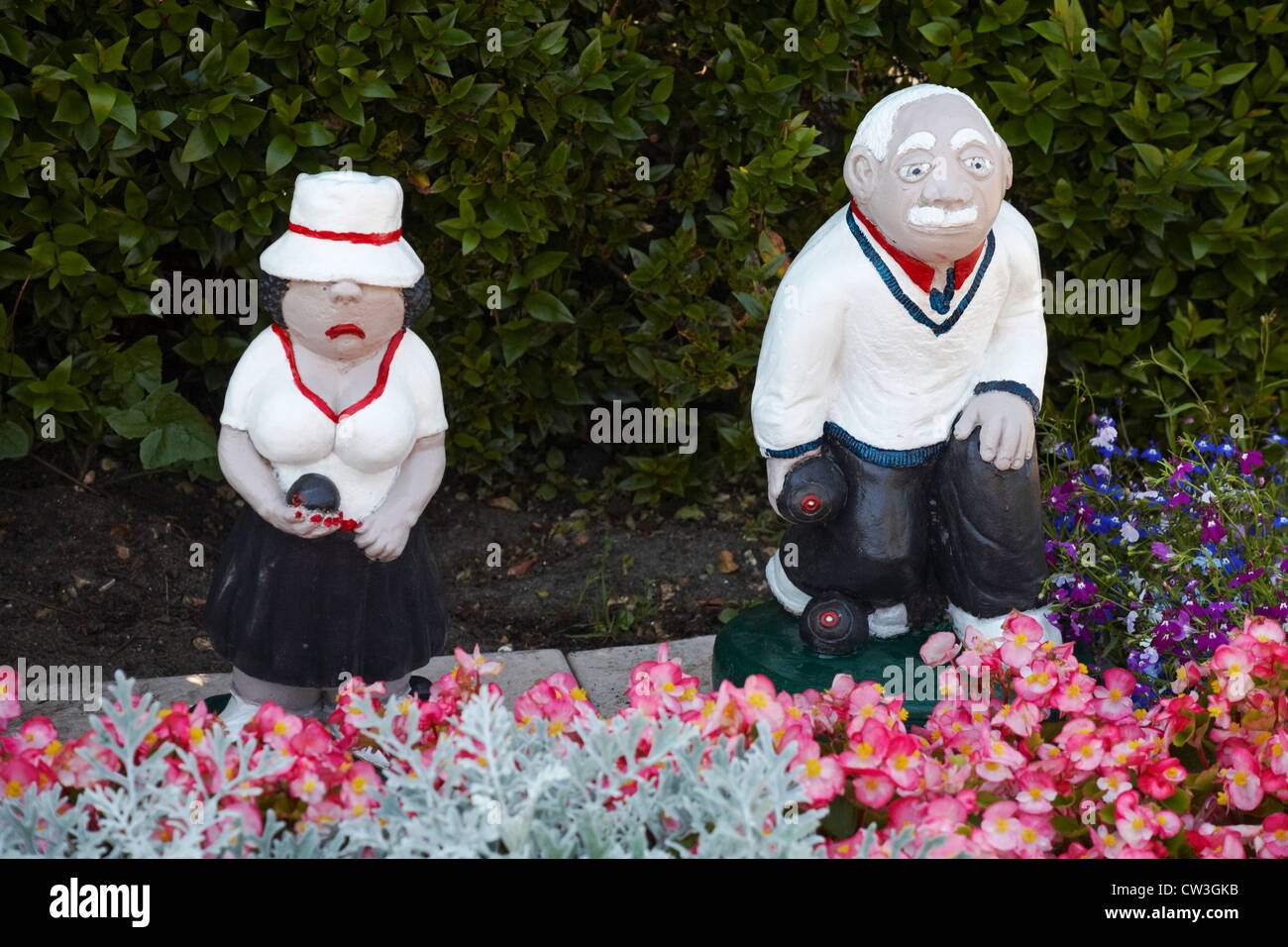 bowlers garden ornaments positioned in flower bed at bowling club