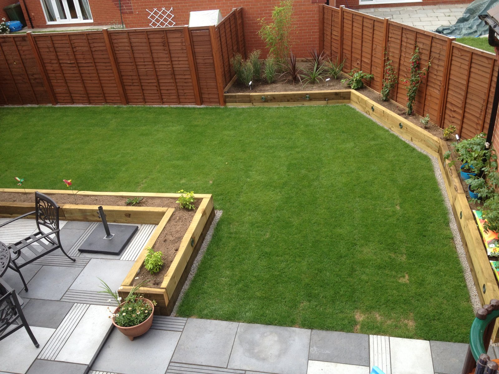 paving, raised sleeper beds and garden lighting - wardens fencing