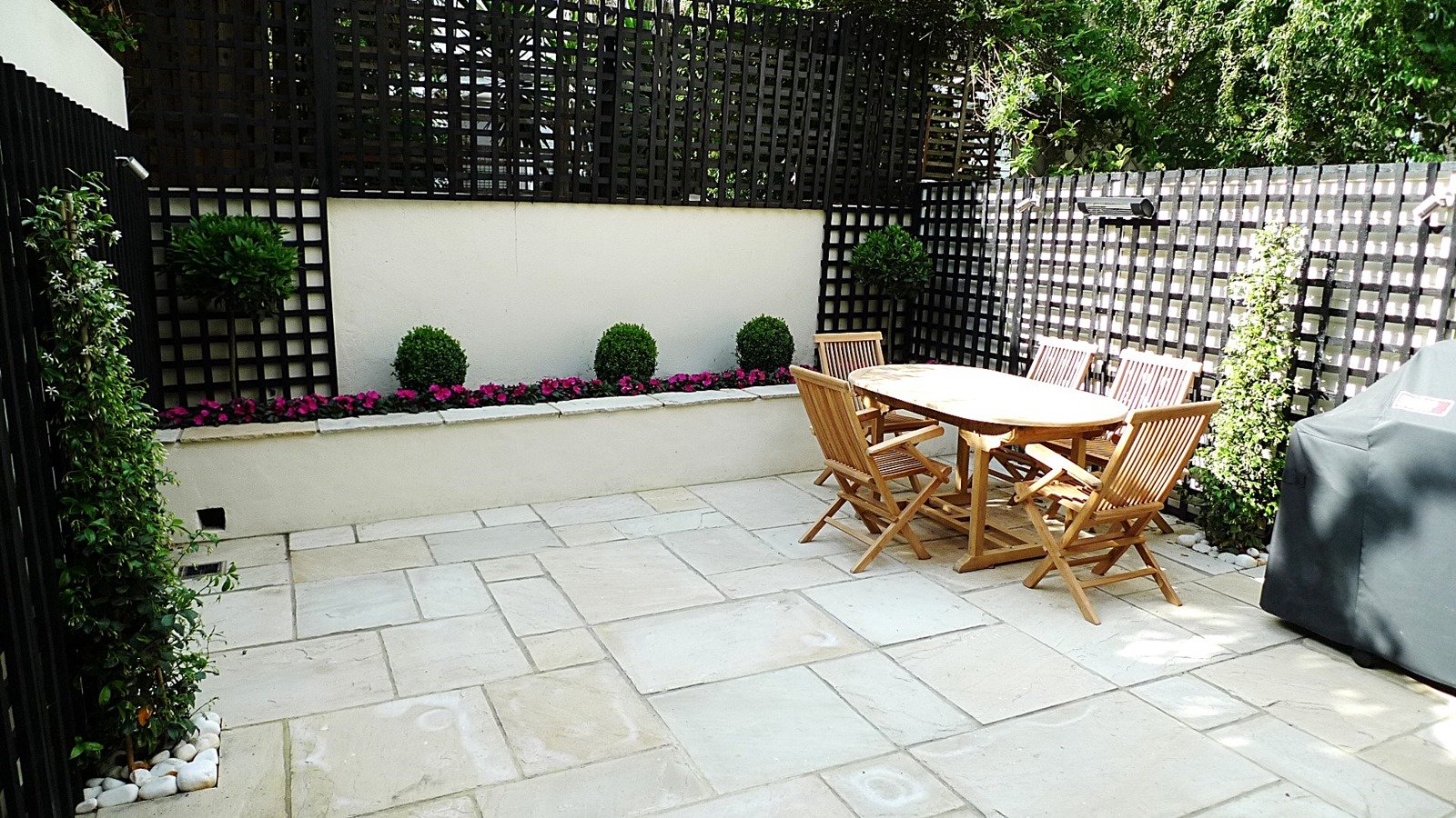 sandstone paving patio raised beds classic modern planting black