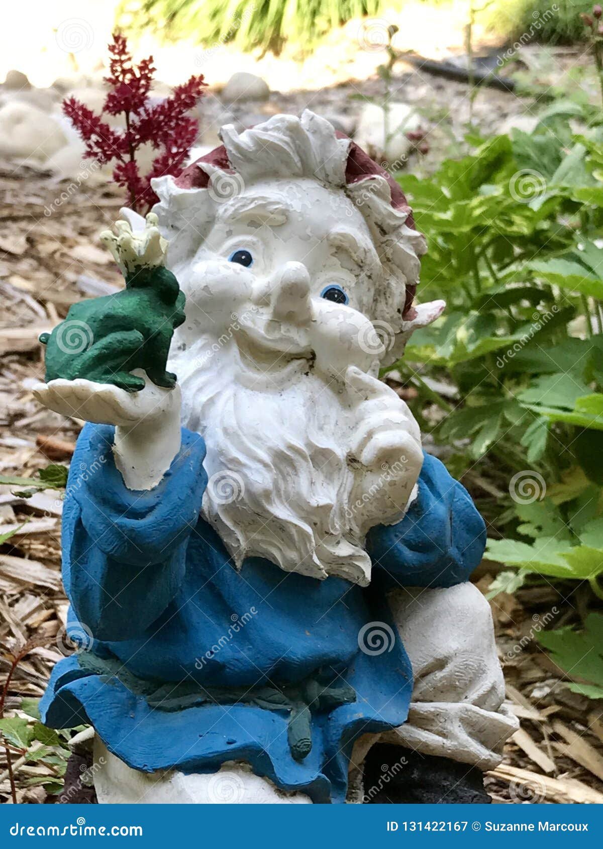 decorative ceramic garden ornaments amidst flower garden stock image